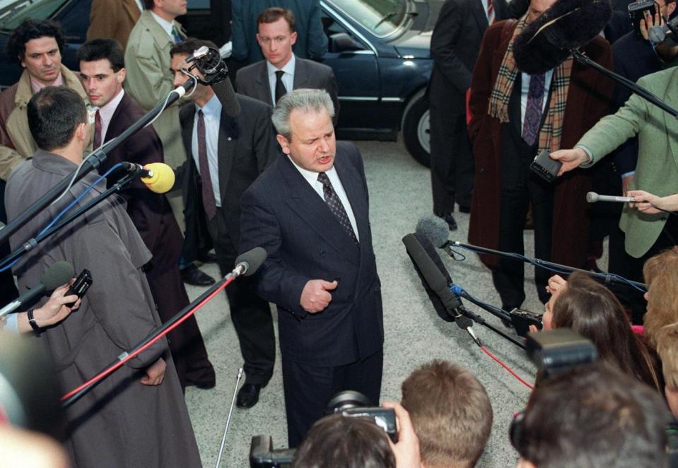 Slobodan Milosevic addresses the media in Paris in March 1993 (Getty)