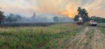 Smoke from the Sand Fire is seen at sunset in the Capay Valley in California