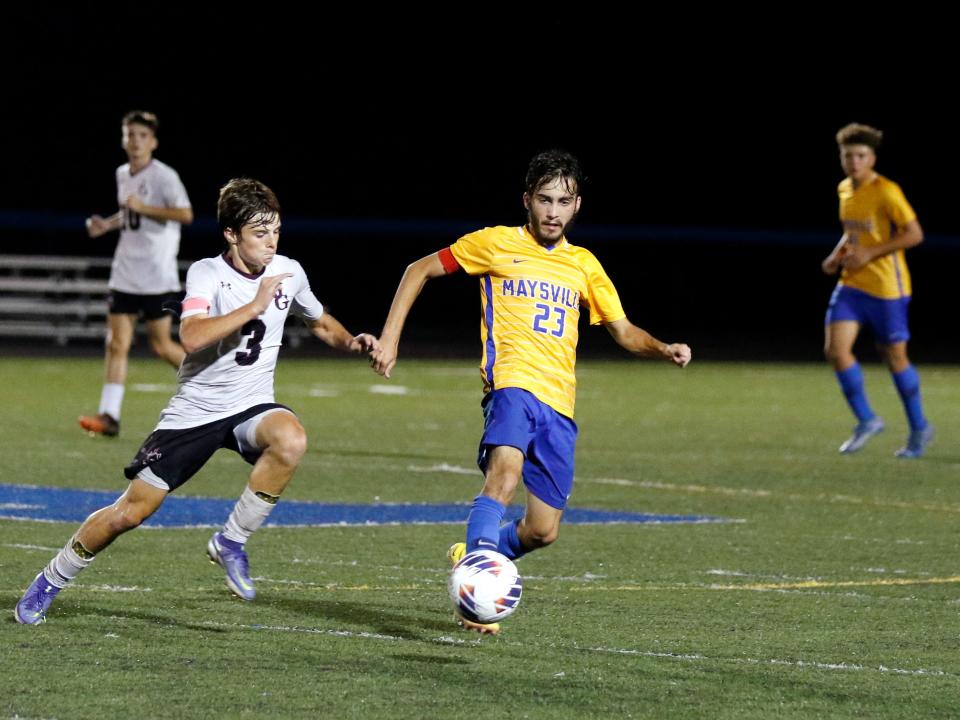 Maysville's Landon Lane and John Glenn's Kanon Riehl go for possession of the ball during Tuesday's first-place battle in the Muskingum Valley League. The Muskies won 3-2.