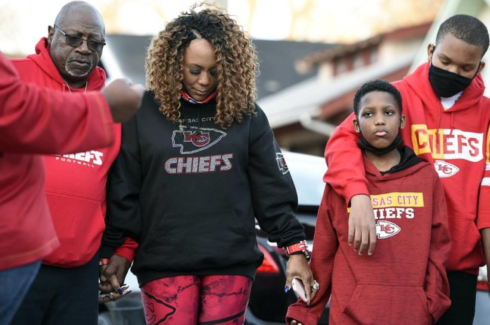 On the second anniversary of his death, the family of Cameron Lamb gathered Dec. 3, in front of the house where he was shot killed in his backyard. Lamb’s father, Aquil Bey, left, and his mother, Laurie Bey, joined hands in prayer after releasing balloons. Lamb was shot by Kansas City, Missouri police officer, Eric DeValkenaere, who has been convicted of involuntary manslaughter.