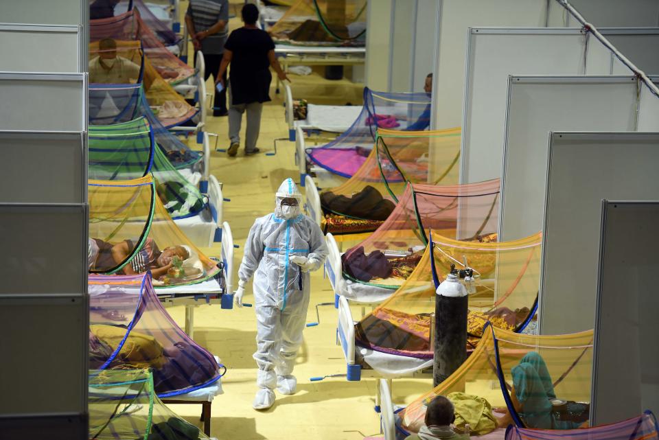 NEW DELHI, INDIA - APRIL 29: Covid-19 patients recuperating at the Covid-19 care centre at the Commonwealth Games (CWG) Village on April 29, 2021 in New Delhi, India. As Covid-19 cases continued to surge in Delhi with over 97,977 active cases people are struggling to get hospital beds, ventilators, oxygen cylinders, injections and medicines with the health infrastructure in the state almost stretched to its limit.  (Photo by Raj K Raj/Hindustan Times via Getty Images)