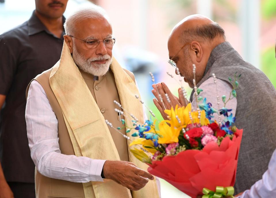 “This is the dawn of a new India,” proclaimed jubilant party worker Chandar Triparti as he celebrated an improbable victory for Narendra Modi’s ruling Bharatiya Janata Party (BJP) in India’s general election on Thursday.There is a sense here in India that this result, with the BJP winning an even larger majority than they did in the landslide of 2014, gives an unprecedented mandate to an incumbent prime minister to continue and build on the work of his first term.Voters across the country told The Independent they backed Mr Modi and his achievements so far, and even those with doubts largely said they were willing to give him one last chance.Mr Modi’s team spent much of Friday thanking world leaders who had congratulated him on his victory, while the man himself started talks on forming a cabinet that will include - but not rely upon - a coalition of allies who together command an extraordinary 350 of the 542 Lok Sabha (lower house of parliament) seats.The prime minister also instructed ministries to begin drawing up plans for the first 100 days of the new administration. But in truth these efforts started months ago, according to leaks from officials, as pre-election polls always predicted the BJP would win - just not by such a margin.Mr Modi has long said his priority is the economic development of India - his most enduring slogan has been “sabka saath, sabka vikas”, meaning “collective efforts, inclusive growth”.With unemployment at its highest rate in decades, the economy slowing, and major infrastructure like the railways in a sorry state, the BJP knows it needs to be seen to be delivering more if it is to cement its place at the top of Indian politics for many years to come.After some rogue assembly election results in December rattled the party’s confidence, Mr Modi made some big promises in the hope of winning over any hesitant voters.They include a pledge to double farmers’ incomes, to make India the world’s third-largest economy by 2030 and to spend more than £1.1 trillion — four times the country's annual budget — on improved infrastructure. “The programmes Mr Modi has promised in the past, even those seen as successes like Clean India and the provision of cheap cooking gas, have huge shortfalls, and it would be prudent for the government to plug the gaps and see them mature,” said political scientist and author Ajay Mehra, currently working on a book on the prime ministers of India.Settling for consolidation isn’t in the prime minister’s nature, however. “Modi himself likes to roll out these schemes with fancy names and his image on the poster - then whether they are implemented or not is another matter. They [the BJP] might say that this huge mandate shows the acceptance of the people - whether these programmes have actually reached them or not.”While Mr Modi might want to focus on the challenge of the economy, that’s not the main reason many of supporters voted for him.Asked what she wants to see from this second term, BJP Delhi worker Pinkesh Rana said her first priorities were “articles 35A and 370”.It’s a reference to the rules that give Jammu and Kashmir special status in the constitution, allowing the state to restrict who it allows to become a permanent resident and thereby maintaining its unique demography as the only Muslim-majority state in India.The BJP has promised to do away with the articles - and this is just one of its social policies that invoke the fervour of its Hindu nationalist base and leaves the country’s 180 million Muslims feeling under threat.Ms Rana’s second priority? “I hope he works in the next five years to build the temple,” she says, meaning the temple to Lord Ram that many Hindus want to see built in Ayodhya on the site where an important mosque was pulled down by right-wing rioters in 1992. Mr Mehra says the “minuscule” opposition will struggle to stand up for India’s founding secular ideology and stop the BJP pushing its Hindu-first agenda on others.“They will be able to say that minorities are just that, we are the majority, and what we say goes. So if they say nobody should eat beef, nobody will eat beef. If they say there should be no cow slaughter, then it will be so. And if they say that cities with Muslim names must change, then they will.“They have been doing this [for five years], and now they will keep doing it with greater assertion.” And what about that opposition? This election has provided yet another miserable result for the Grand Old Party of Indian politics, the Congress, which has ruled the country for the majority of the years since independence but now seems to be in freefall.Congress won just 52 seats in Thursday’s results, up only eight on its historic worst ever performance in 2014 - and that despite supposedly having anti-incumbency sentiment in its favour.The final blow, it seems, has been the failure of Congress chief Rahul Gandhi to secure his home constituency, Amethi in Uttar Pradesh, where the scions of the Nehru-Gandhi family have ruled for generations.Mr Gandhi offered to resign as party president in the aftermath of the results but looks set to have his offer rejected.Yet if he stays on, and if efforts continue to promote his sister Priyanka Gandhi Vadra as a successor, then it is difficult to see how the party can shake off its image, hammered home in BJP messaging, of being simply a vehicle to empower one political dynasty.For while BJP workers say the win was “100 per cent Modi”, behind the figure of one strong leader is a team of well known and well liked politicians all pushing in the same direction.If Congress cannot rediscover its base of support and establish itself as a party with more credible leaders across the nation than just the Gandhi siblings, then it is difficult to see how the party can offer an effective nationwide opposition going forwards.The problem with Indian politics is that elections come thick and fast - four states are due to hold their legislative assembly polls later this year. After this trouncing, Congress doesn’t have long to conduct a post mortem and bounce back - if it can do so at all.“Now is a time for very serious introspection [for Congress],” said Mr Mehra. “I would not write the obituary of the party just yet, for me the idea of the Congress is not yet dead. But it is in very bad shape at the moment.”