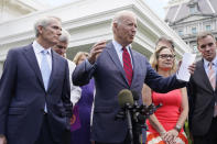 President Joe Biden, with a bipartisan group of senators, speaks Thursday June 24, 2021, outside the White House in Washington. Biden invited members of the group of 21 Republican and Democratic senators to discuss the infrastructure plan. From left are, Sen. Rob Portman, R-Ohio, Sen. Bill Cassidy, R-La., Sen. Lisa Murkowski, R-Alaska, Biden, Sen, Joe Manchin, D-W.Va., rear, Sen. Kyrsten Sinema, D-Ariz, and Sen. Mark Warner, D-Va.. (AP Photo/Jacquelyn Martin)