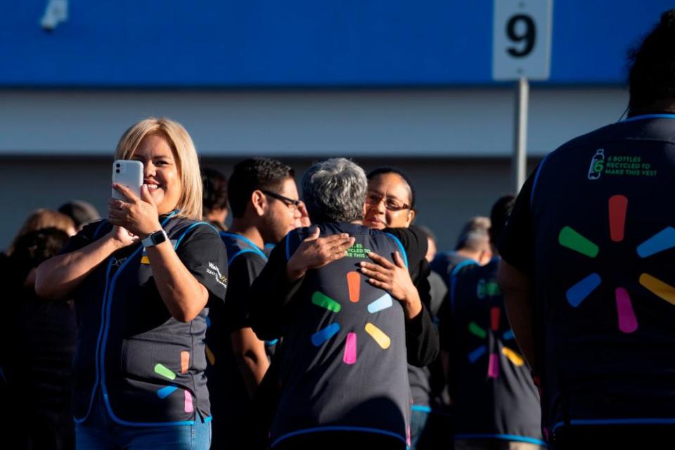 Employees gather before the opening of the Walmart store in El Paso, Texas, which was the site of one of the deadliest mass shootings in modern US history.