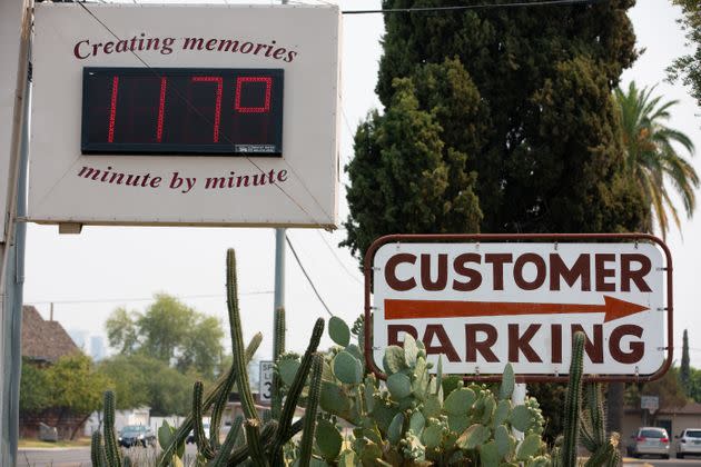 A thermometer sign displays a temperature of 117 degrees Fahrenheit on Tuesday in Phoenix. (Photo: Caitlin O'Hara via Getty Images)