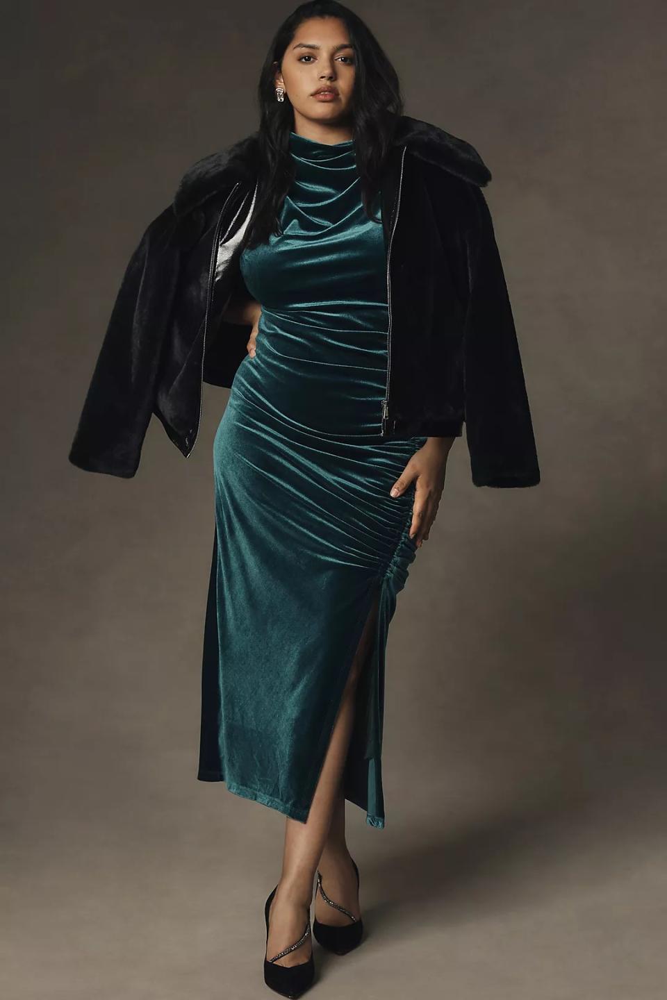 model wearing maxi green velvet dress