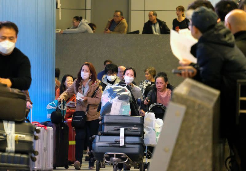 Passengers arrive at LAX from Shanghai, China