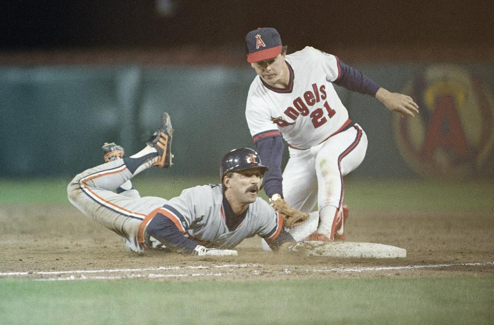 Tom Brookens (left) of the Detroit Tigers dives safely back to first base ahead of the tag by Wally Joyner of the California Angels during the fourth inning at Anaheim Stadium on Thursday, May 5, 1988. Brookens was caught between first and second on a pitchout but returned to first safely.