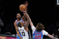 Brooklyn Nets' Kevin Durant, left, and Tyler Johnson, right, defend San Antonio Spurs' DeMar DeRozan, center, during the second half of an NBA basketball game Wednesday, May 12, 2021, in New York. (AP Photo/Frank Franklin II)