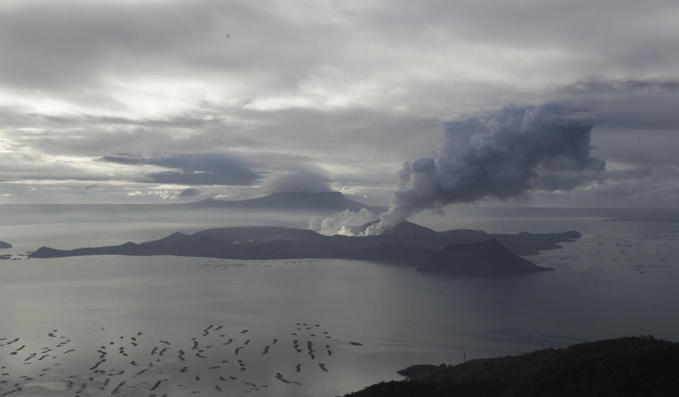 File Photo: A cloud of steam comes out of Taal Volcano as seen from Tagaytay, Cavite province, southern Philippines on Friday Jan. 17, 2020. (AP Photo/Aaron Favila)