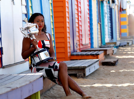 Tennis - Australian Open - Women's Singles Photo Shoot - Brighton Beach, Melbourne, Australia, January 27, 2019. Japan's Naomi Osaka poses with a trophy. REUTERS/Aly Song