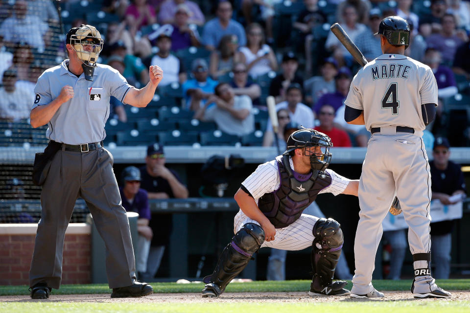 If MLB implements an automated ball-strike system soon, it could drastically change the dynamic between pitcher, catcher and hitter. (Photo by Doug Pensinger/Getty Images)