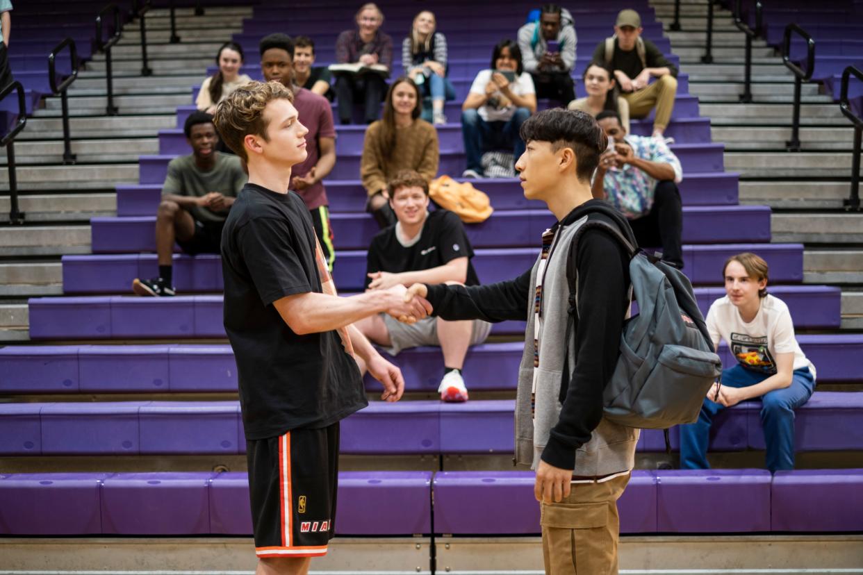Basketball-loving marching band kid Chang (Bloom Li, left) bets star hoopster Matt (Chase Liefeld) that he can dunk in the coming-of-age sports comedy 