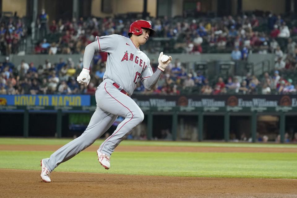 Los Angeles Angels' Shohei Ohtani sprints around third on his way home to score on a Phil Gosselin single in the fifth inning of a baseball game against the Texas Rangers in Arlington, Texas, Tuesday, Aug. 3, 2021. (AP Photo/Tony Gutierrez)