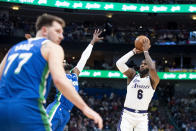 Los Angeles Lakers forward LeBron James (6) attempts a three-point shot in the first half of an NBA basketball game in Dallas, Sunday, Dec. 25, 2022. (AP Photo/Emil T. Lippe)