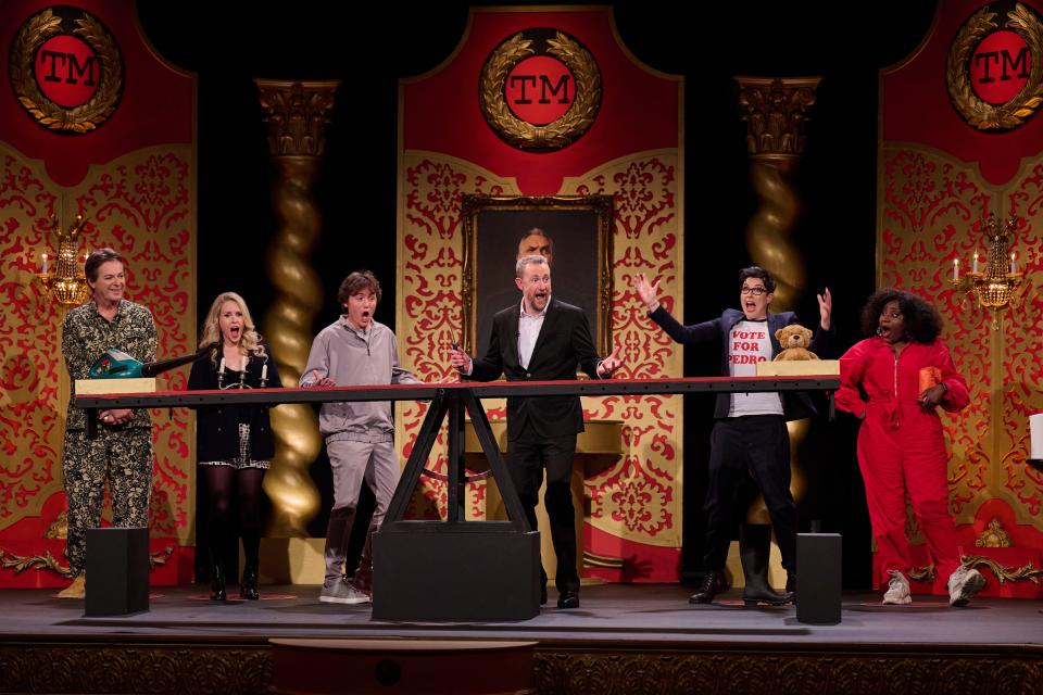 Alex Horne (center) and the Season 16 "Taskmaster" contestants: Julian Clary, Lucy Beaumont, Sam Campbell, Sue Perkins and Susan Wokoma,