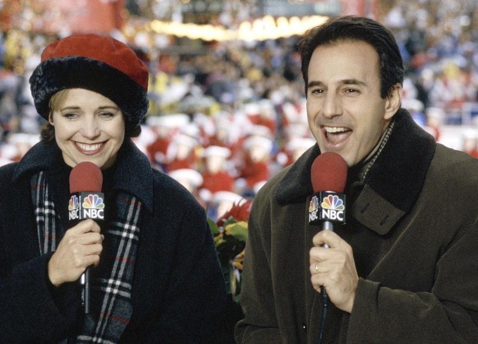 Katie Couric announcing at an event next to co-host Matt Lauer