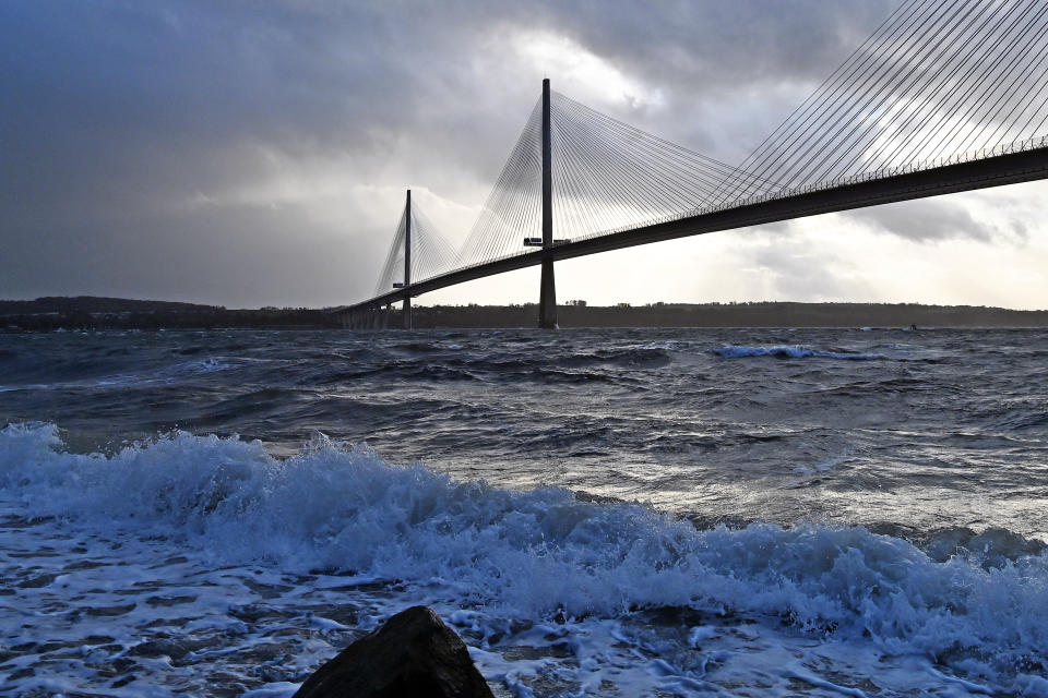 NORTH QUEENSFERRY, SCOTLAND - FEBRUARY 16: Storm Dudley brings a stormy sky, and large waves beneath the Queensferry Crossing road bridge over the Forth Estuary, on February 16, 2022, in North Queensferry, Scotland. Travel disruption and power cuts are expected over the next few days as amber weather warnings were issued across most of UK..  (Photo by Ken Jack/Getty Images)