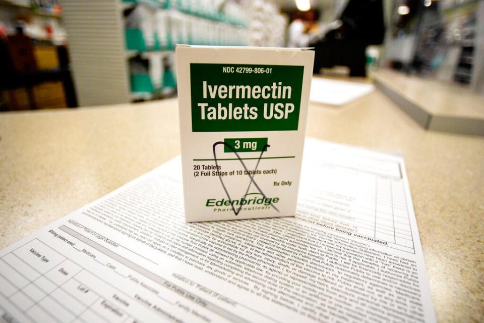 A box of ivermectin is shown in a pharmacy as pharmacists work in the background, Thursday, Sept. 9, 2021, in Ga.