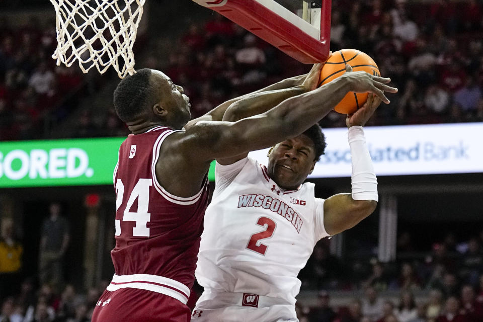 Indiana's Payton Sparks (24) fouls Wisconsin's AJ Storr (2) during the second half of an NCAA college basketball game Friday, Jan. 19, 2024, in Madison, Wis. (AP Photo/Andy Manis)
