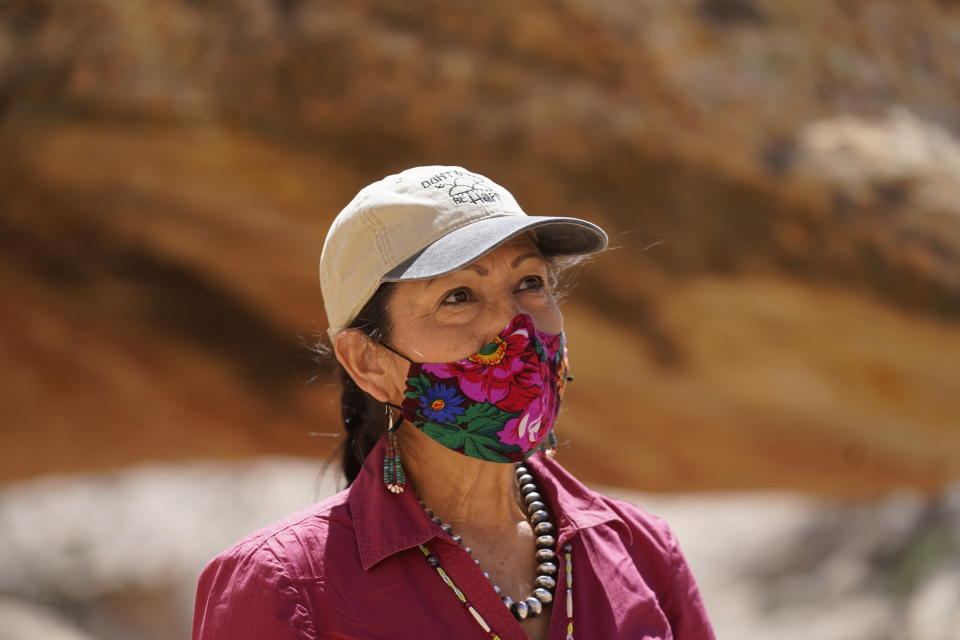 U.S. Interior Secretary Deb Haaland tours near ancient dwellings along the Butler Wash trail during a visit to Bears Ears National Monument Thursday April 8, 2021, near Blanding, Utah. (AP Photo/Rick Bowmer, Pool)