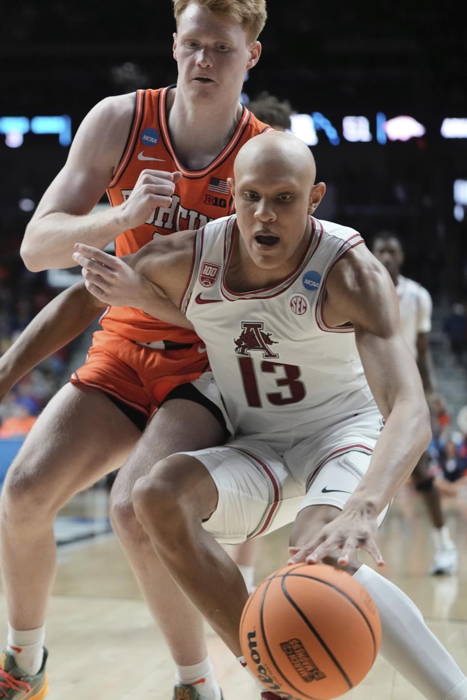 Arkansas's Jordan Walsh tries to get past Illinois's Luke Goode during the second half of a first-round college basketball game in the NCAA Tournament Thursday, March 16, 2023, in Des Moines, Iowa. (AP Photo/Morry Gash)