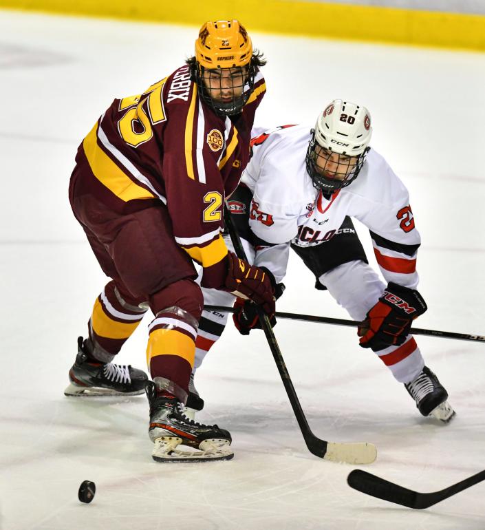 St. Cloud State's Nolan Walker and Jack Perbix of the University of Minnesota battle for control of the puck during the game Saturday, Oct. 16, 2021 at the Herb Brooks National Hockey Center in St. Cloud. 