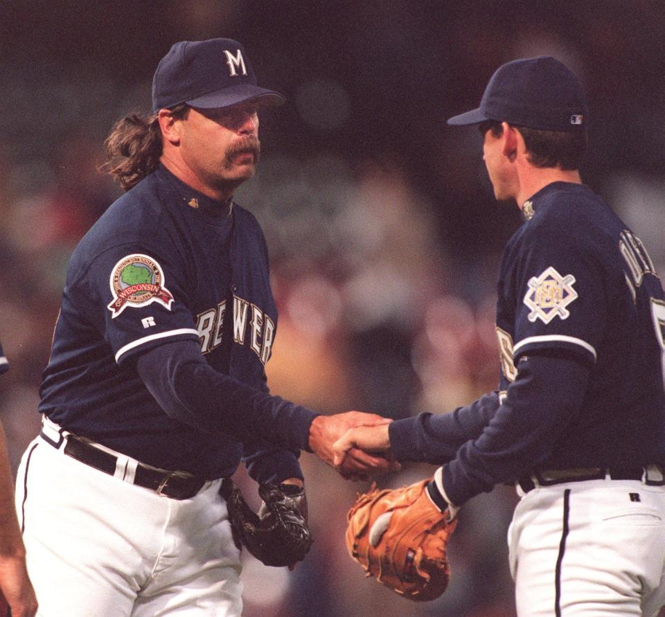 Brewer reliever Doug Jones (left) gets a handshake from Mark Loretta Friday, May 8, 1998, after Jones locked down a save to beat the Astros.