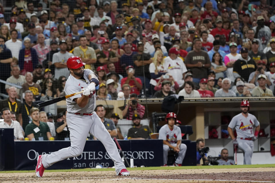 St. Louis Cardinals' Albert Pujols hits a single during the seventh inning of the team's baseball game against the San Diego Padres, Wednesday, Sept. 21, 2022, in San Diego. (AP Photo/Gregory Bull)