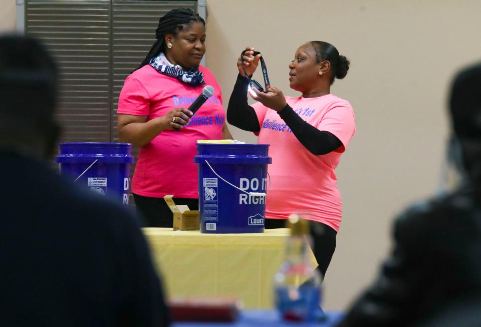 Stacey Henry (left) and Shani Pierce, both of Wilmington, review components of emergency preparedness kits as they participate in a workshop of the Delaware Resiliency Hub at the Wilmington PAL Center, Saturday, April 29, 2023.
