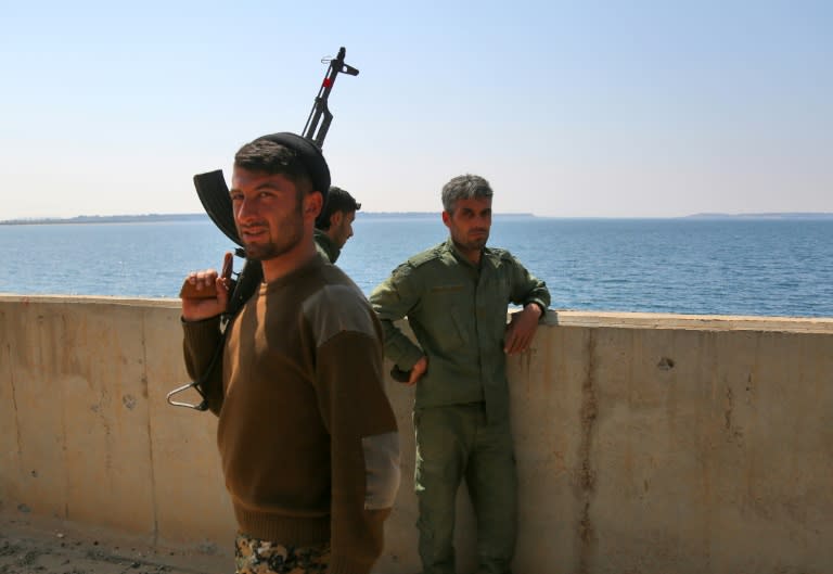 Members of the US-backed Syrian Democratic Forces (SDF) at the Taqba Dam on March 28, 2017