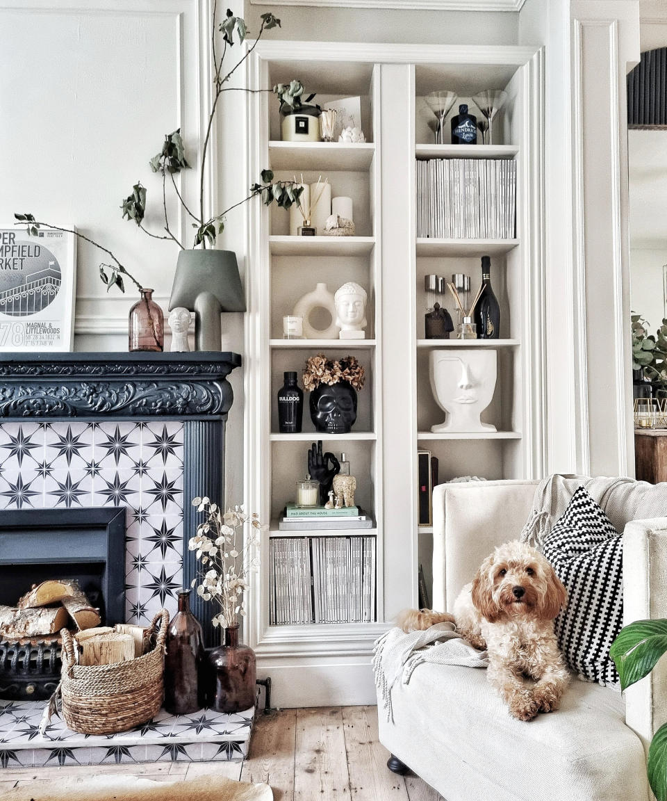 A living room with a floor to ceiling bookcase made with IKEA BILLY