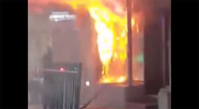 The flames escaping from the front of the shop. Source: 7News