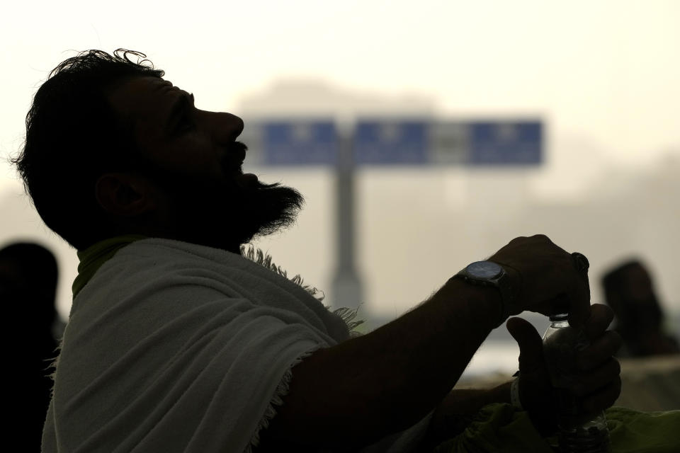 Pilgrims cast stones at a pillar in the symbolic stoning of the devil, the last rite of the annual Hajj pilgrimage, in Mina near the holly city of Mecca, Saudi Arabia, Wednesday, June 28, 2023. (AP Photo/Amr Nabil)