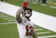 Tampa Bay Buccaneers wide receiver Mike Evans (13) celebrates his touchdown against the New Orleans Saints during the first half of an NFL divisional round playoff football game, Sunday, Jan. 17, 2021, in New Orleans. (AP Photo/Brett Duke)