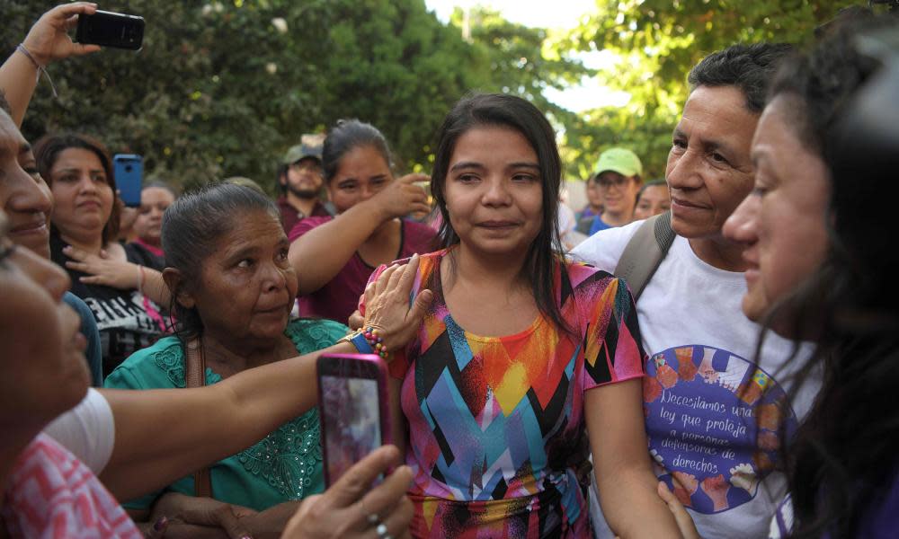 Imelda Cortez, centre, is accompanied by relatives after she was acquitted and released, outside the judicial centre for sentencing in Usulután, El Salvador.