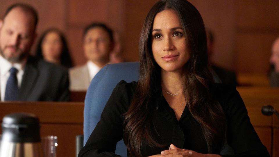 Meghan Markle in character as Rachel Zane in a courtroom