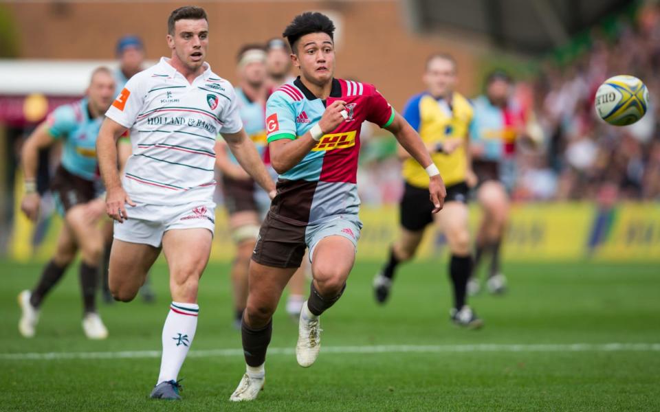 George Ford is beaten to the ball by Marcus Smith - CameraSport