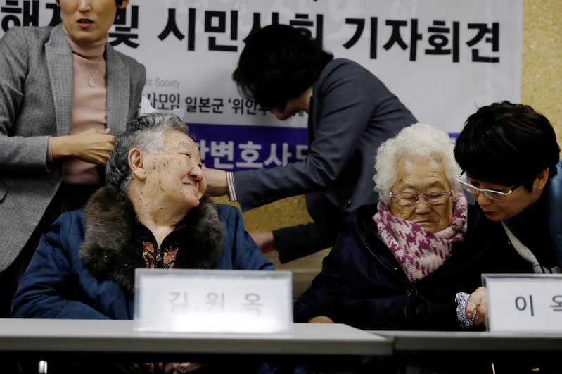 Former South Korean "comfort women" Lee Ok-sun and Gil Won-ok attend a news conference in Seoul