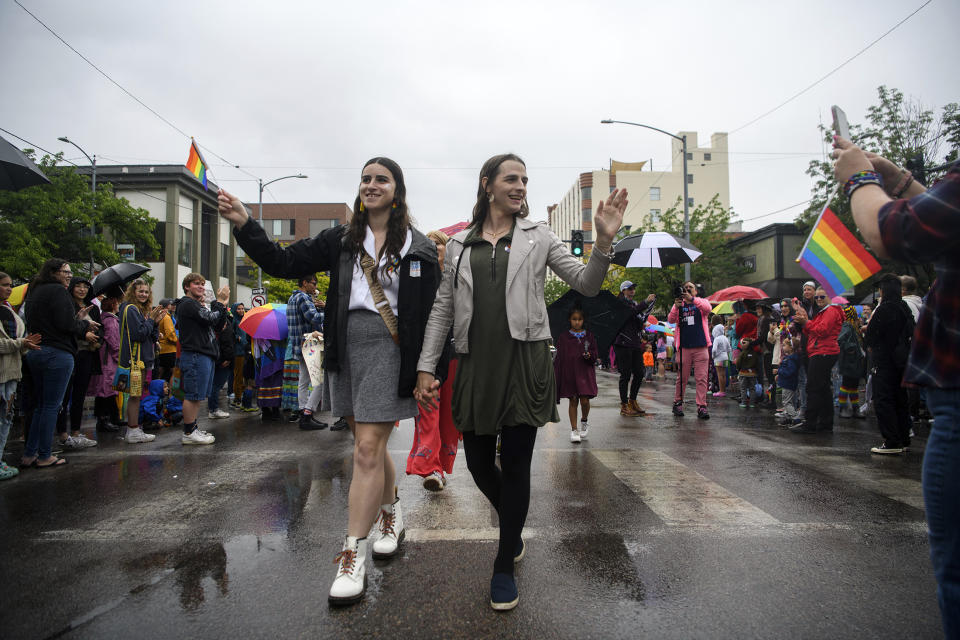 Missoula Rep. Zooey Zephyr, right, and her fiancée Erin Reed wave to supporters during the Missoula Pride Parade on Higgins Avenue on Saturday, June 17, 2023. (Ben Allan Smith/The Missoulian via AP)