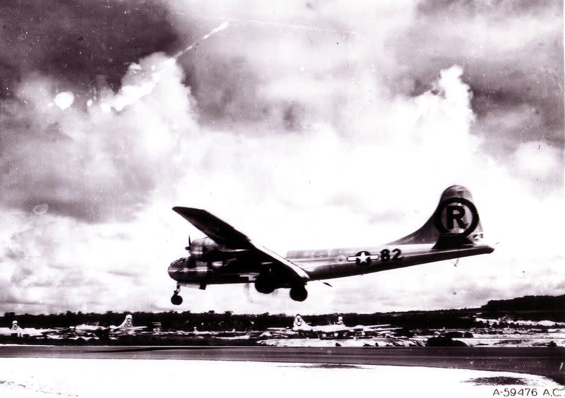 FILE PHOTO: U.S. Air Force handout photo of the Enola Gay B-29 bomber landing in the Mariana Islands