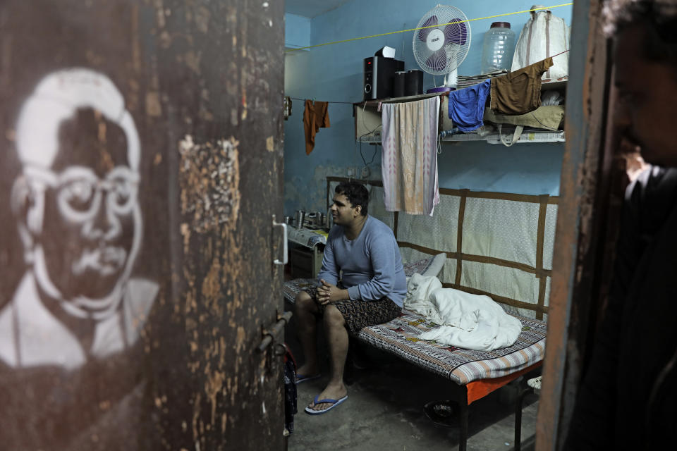 Surya Prakash, a blind student, who was beaten by masked assailants sits inside his hostel room at the Jawaharlal Nehru University in New Delhi, India, Monday, Jan. 6, 2020. More than 20 people were injured in the attack opposition lawmakers are trying to link to the government. The 25-year-old research scholar at the university's Sanskrit school, said that he had been brutally beaten in his dorm room despite crying out that he is blind. (AP Photo/Altaf Qadri)
