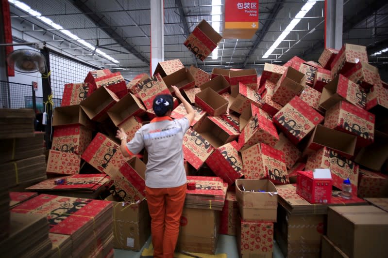 FILE PHOTO: An employee works at a Tmall logistics centre in Suzhou