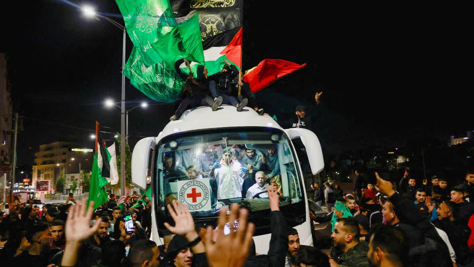 Released Palestinian prisoners react from inside a vehicle after leaving the Israeli military prison, Ofer, amid a hostages-prisoners swap deal between Hamas and Israel, near Ramallah in the Israeli-occupied West Bank, on Sunday. - Ammar Awad/Reuters