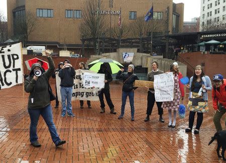 Residents and clean air activists protest in front of the state's Department of Environmental Quality office in Portland, Oregon March 4, 2016. REUTERS/Shelby Sebens