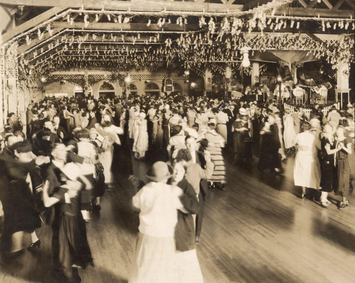 Dancers whisk across the polished wood floor of the Wisteria Ballroom at Summit Beach Park.