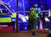 <p>A paramedic rushes to the scene after an incident in central London, Saturday, June 3, 2017. British police said they were dealing with “incidents” on London Bridge and nearby Borough Market in the heart of the British capital Saturday, as witnesses reported a vehicle veering off the road and hitting several pedestrians. (Dominic Lipinski/PA via AP) </p>