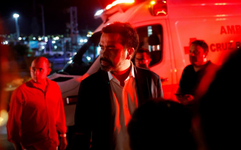 Citizens' Movement party president Jorge Alvarez Maynez reacts at the site after a gust of wind caused a structure to collapse