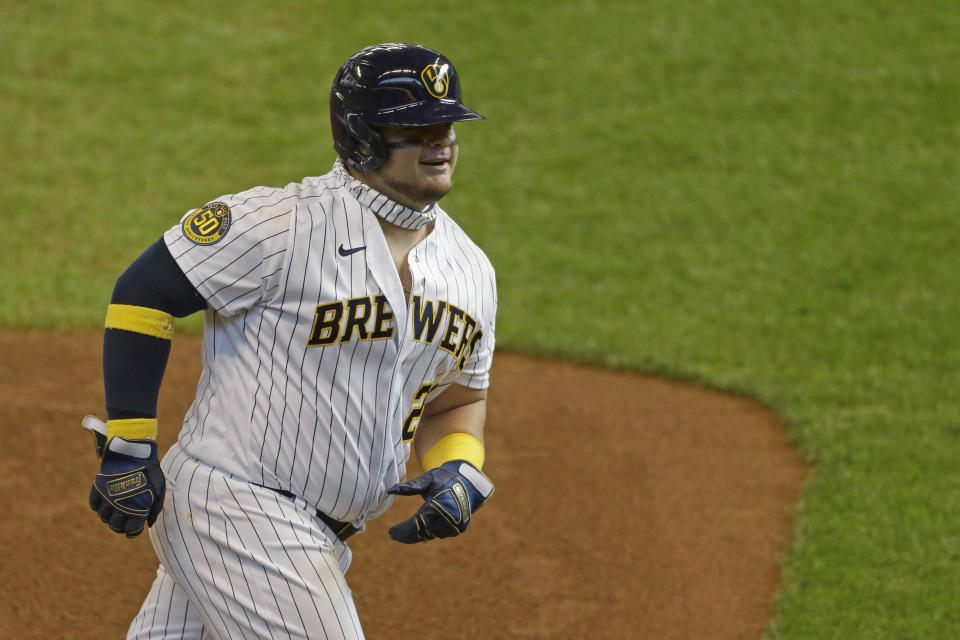 Milwaukee Brewers' Daniel Vogelbach smiles as he rounds third base after hitting a three-run home run during the sixth inning of a baseball game against the Kansas City Royals Sunday, Sept. 20, 2020, in Milwaukee. (AP Photo/Aaron Gash)