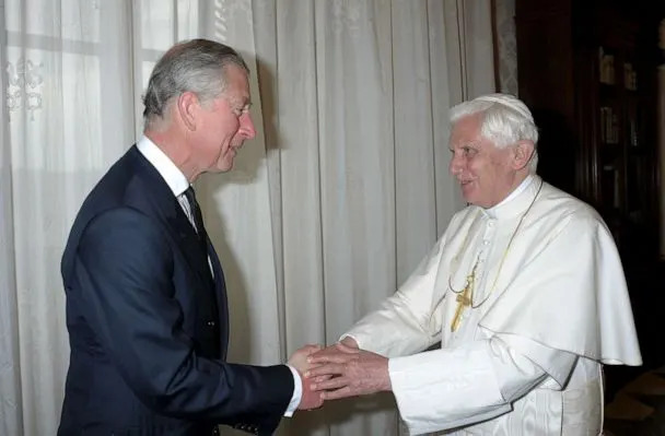 PHOTO: In this April 27, 2009, file photo, Pope Benedict XVI welcomes Britain's Prince Charles prior to their meeting in his private library in the Vatican. (AFP via Getty Images, FILE)